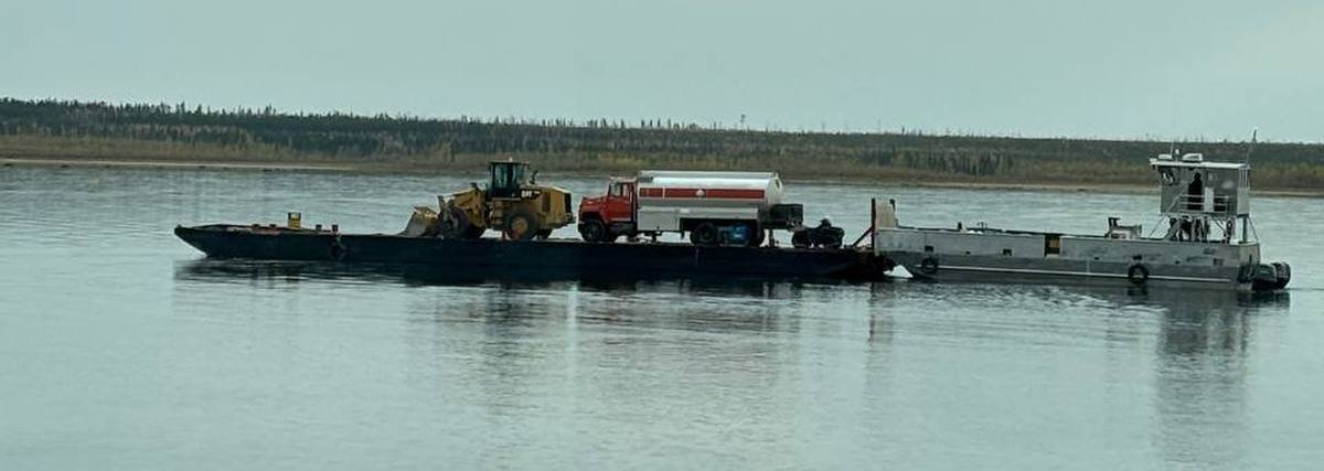 P&M Barging barge transporting a CAT loader and fuel truck