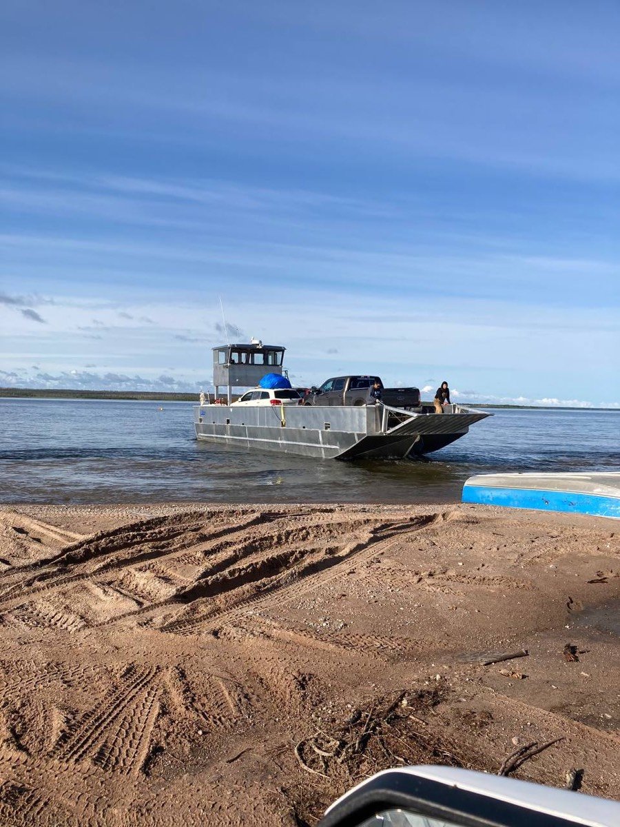 Landing craft carrying a vehicle to a remote shoreline